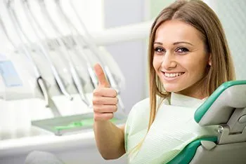 happy patient in dental chair